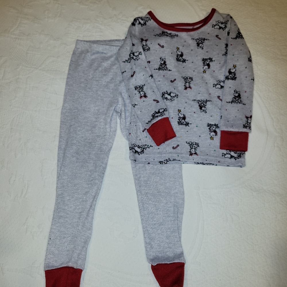 Cozy Kids Pajamas with Puppy wrapped in lights accents.